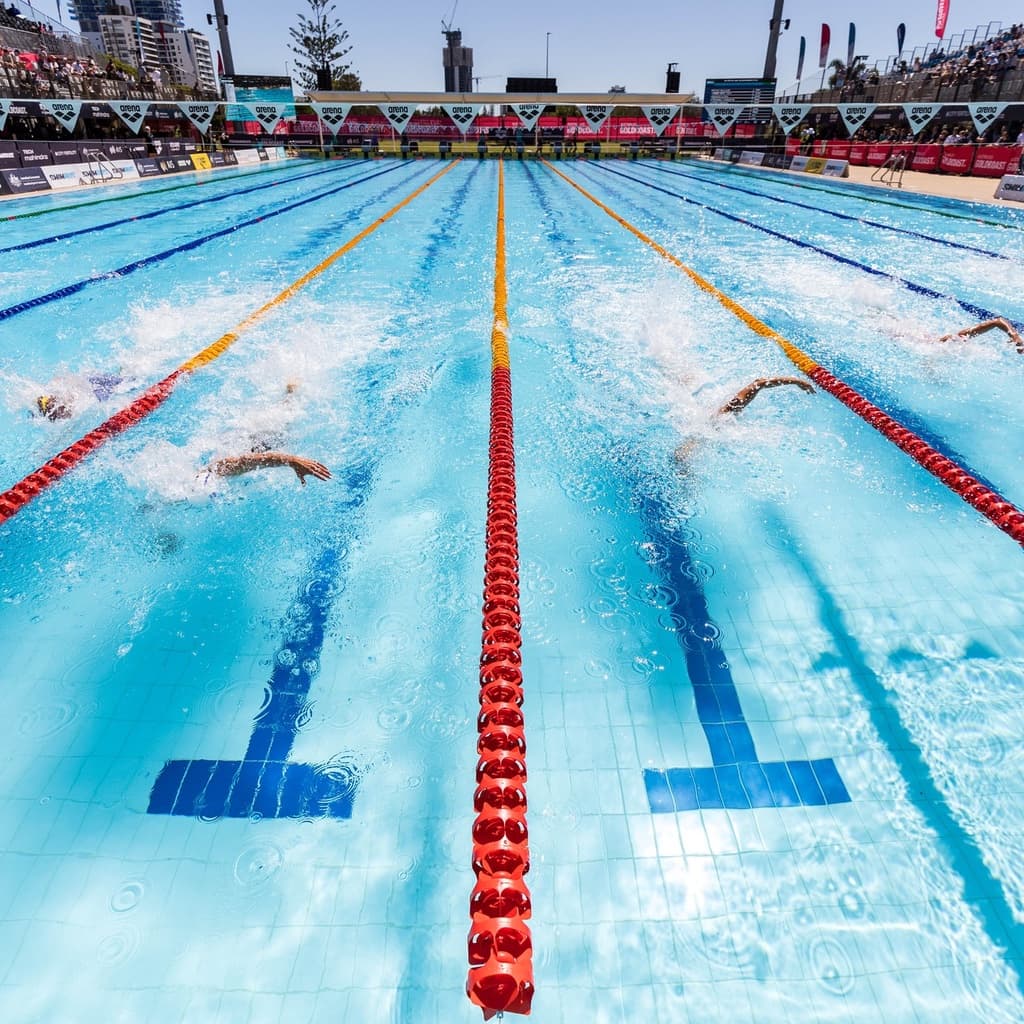 Outdoor competition pool lanes divided by a red lane rope